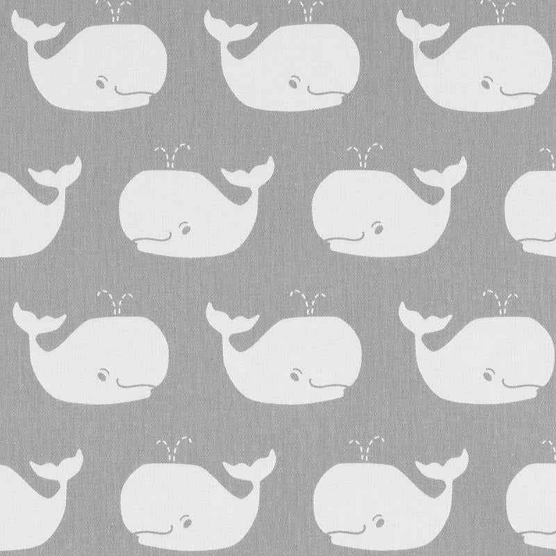 Gray fabric with repeating white whale silhouettes in a playful nautical pattern.