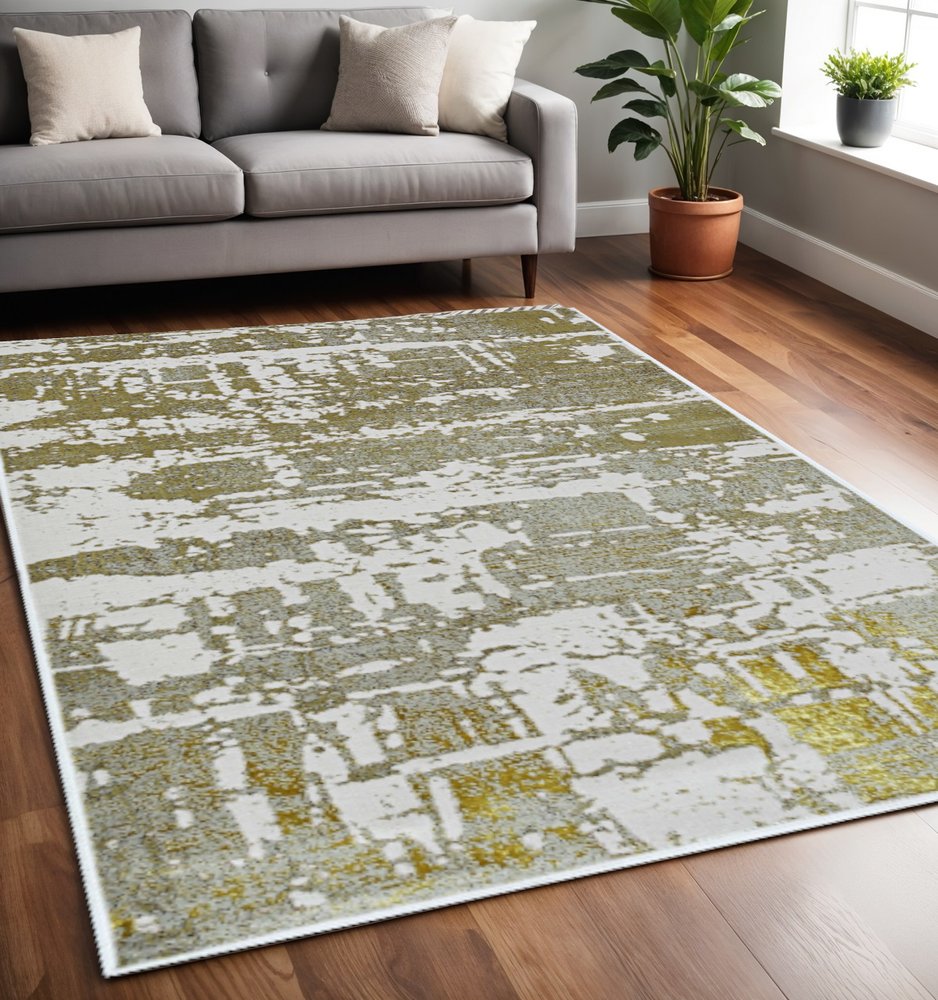 5' X 8' Ivory And Gold Abstract Area Rug