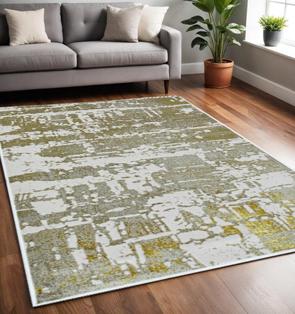 3' X 5' Ivory Taupe And Gold Abstract Area Rug