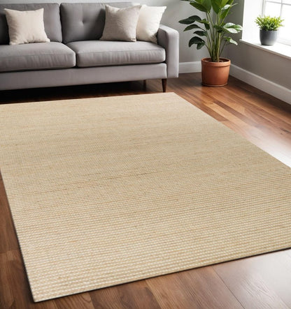 5' X 7' Tan And Ivory Hand Woven Area Rug