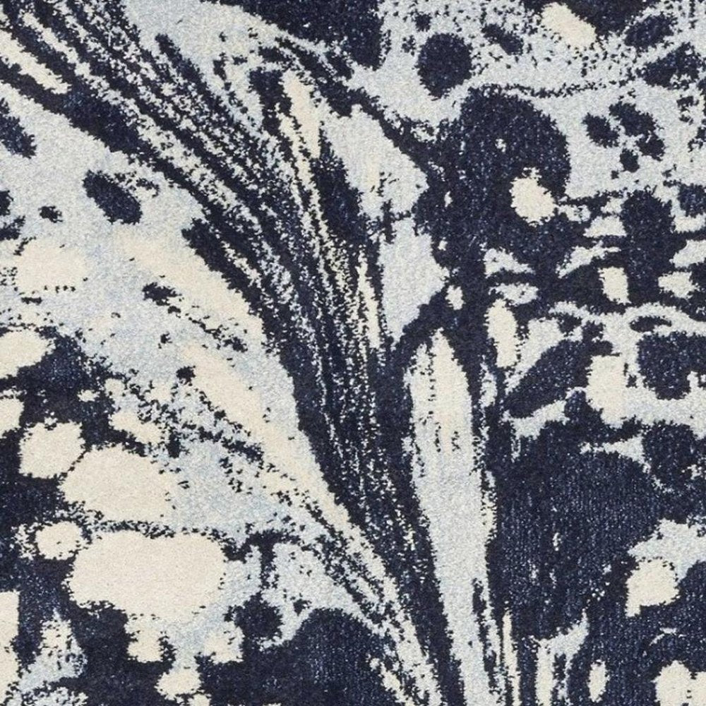 7' X 10' Blue And Ivory Abstract Area Rug