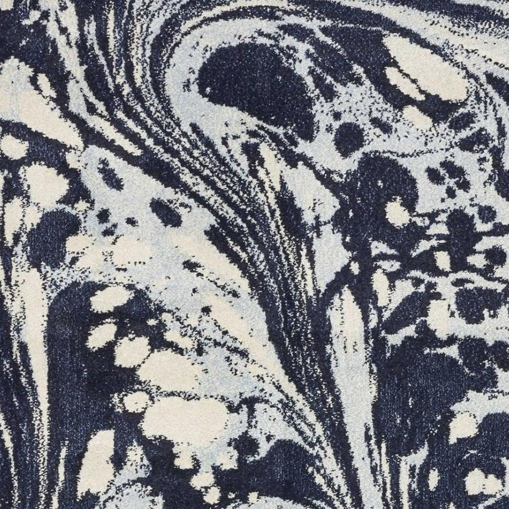 7' X 10' Blue And Ivory Abstract Area Rug