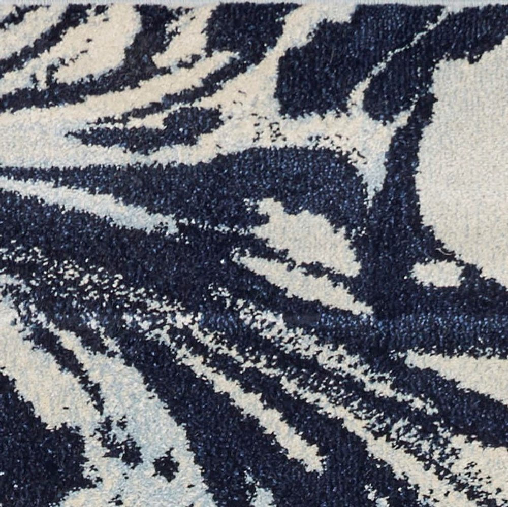 7' X 10' Blue And Ivory Abstract Area Rug