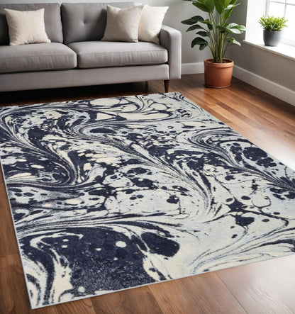 7' X 10' Blue And Ivory Abstract Area Rug