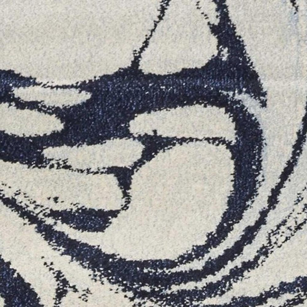7' X 10' Blue And Ivory Abstract Area Rug