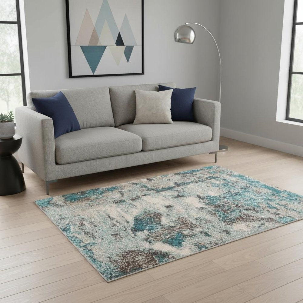 3' X 5' Ivory And Teal Abstract Area Rug