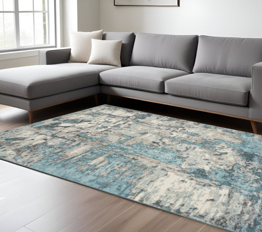 5' X 8' Ivory And Teal Abstract Area Rug