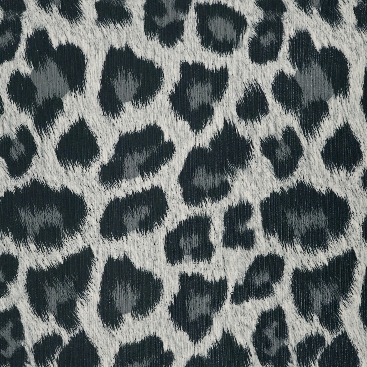 24" x 24" grayscale leopard-print faux fur pillow.