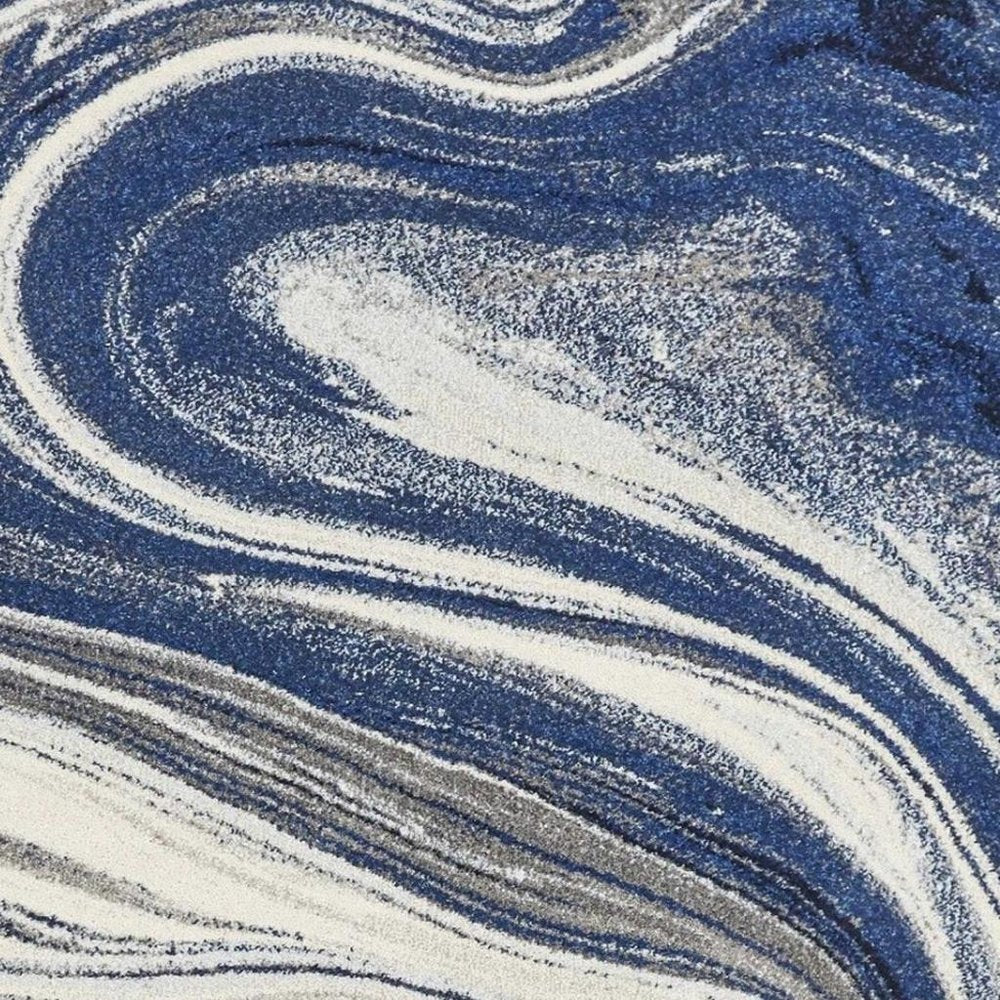 7' X 10' Blue And Beige Abstract Area Rug