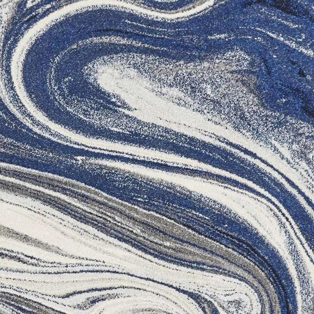 7' X 10' Blue And Beige Abstract Area Rug