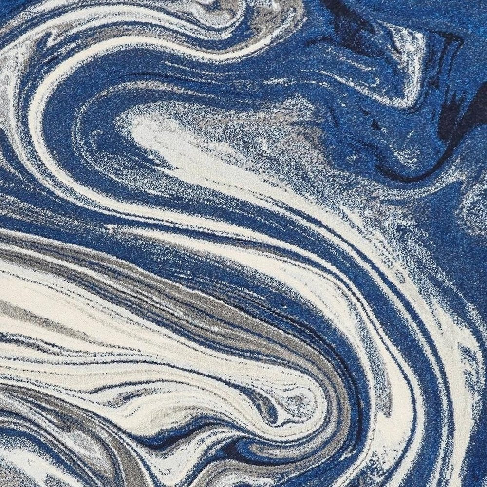 7' X 10' Blue And Beige Abstract Area Rug