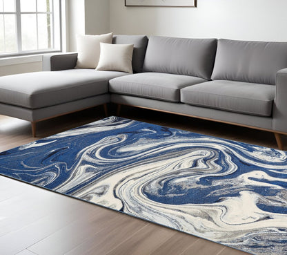 7' X 10' Blue And Beige Abstract Area Rug