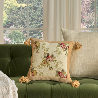 Cream 19 x 19 decorative pillow with a square floral-embroidered center, beige border and tassels.