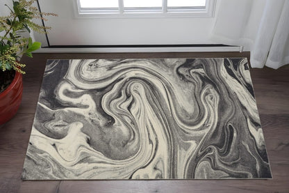 7' X 9' Ivory Black And Gray Abstract Shag Area Rug