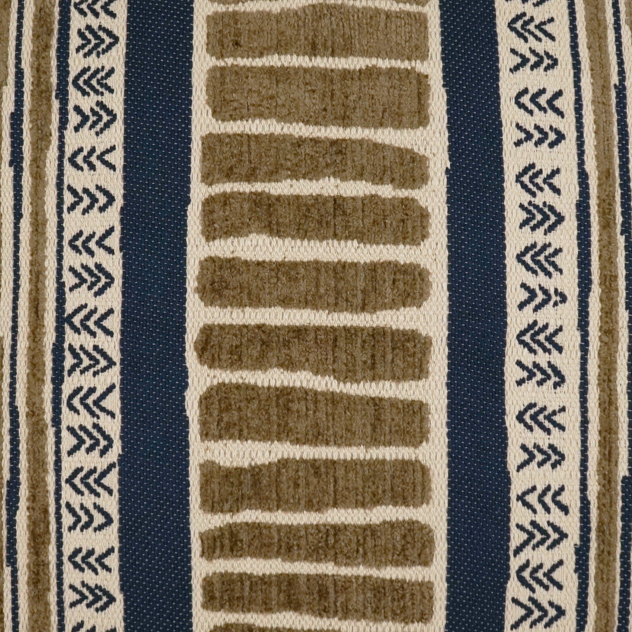 Geometric woven rug in beige, tan & navy with tan rectangular center blocks & dark blue side borders.