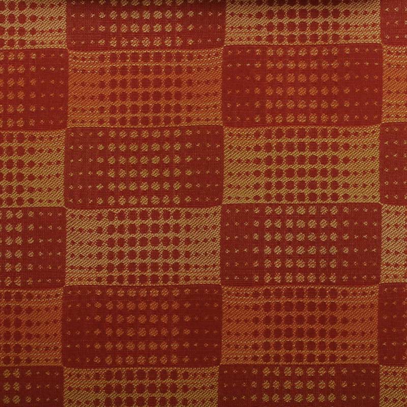 Red and gold checkered woven fabric with dotted square motifs; warm rustic textile for throws or upholstery.