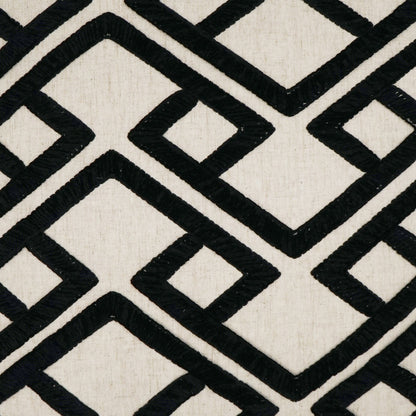 Pillow with beige linen-like fabric and bold black onyx geometric interlocking square/diamond pattern (24 x 24).