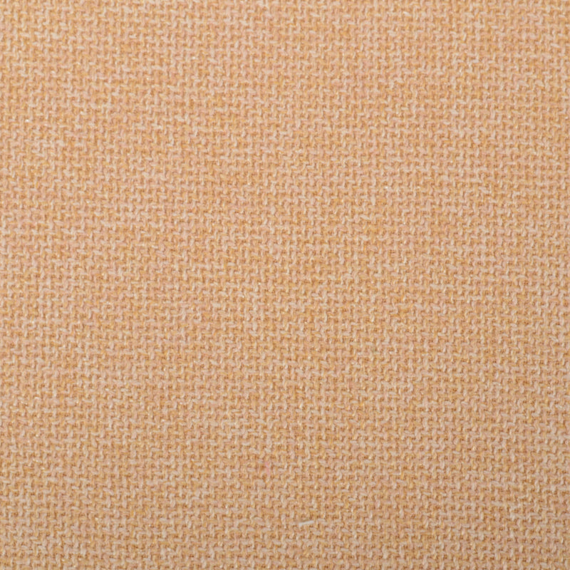 Peachy beige woven fabric close-up with a tight tweed-like texture, soft upholstery or clothing fabric.