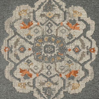 Grey-blue woven pillow, 24" x 24", with cream mandala medallion and orange floral accents; vintage geometric pattern.