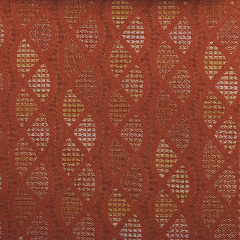 Rust-red woven fabric with gold diamond lattice pattern; geometric, decorative textile for upholstery or apparel.