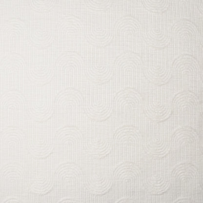 Cream pillow 24" x 24" with a repeating circular quilted pattern and soft, textured fabric.