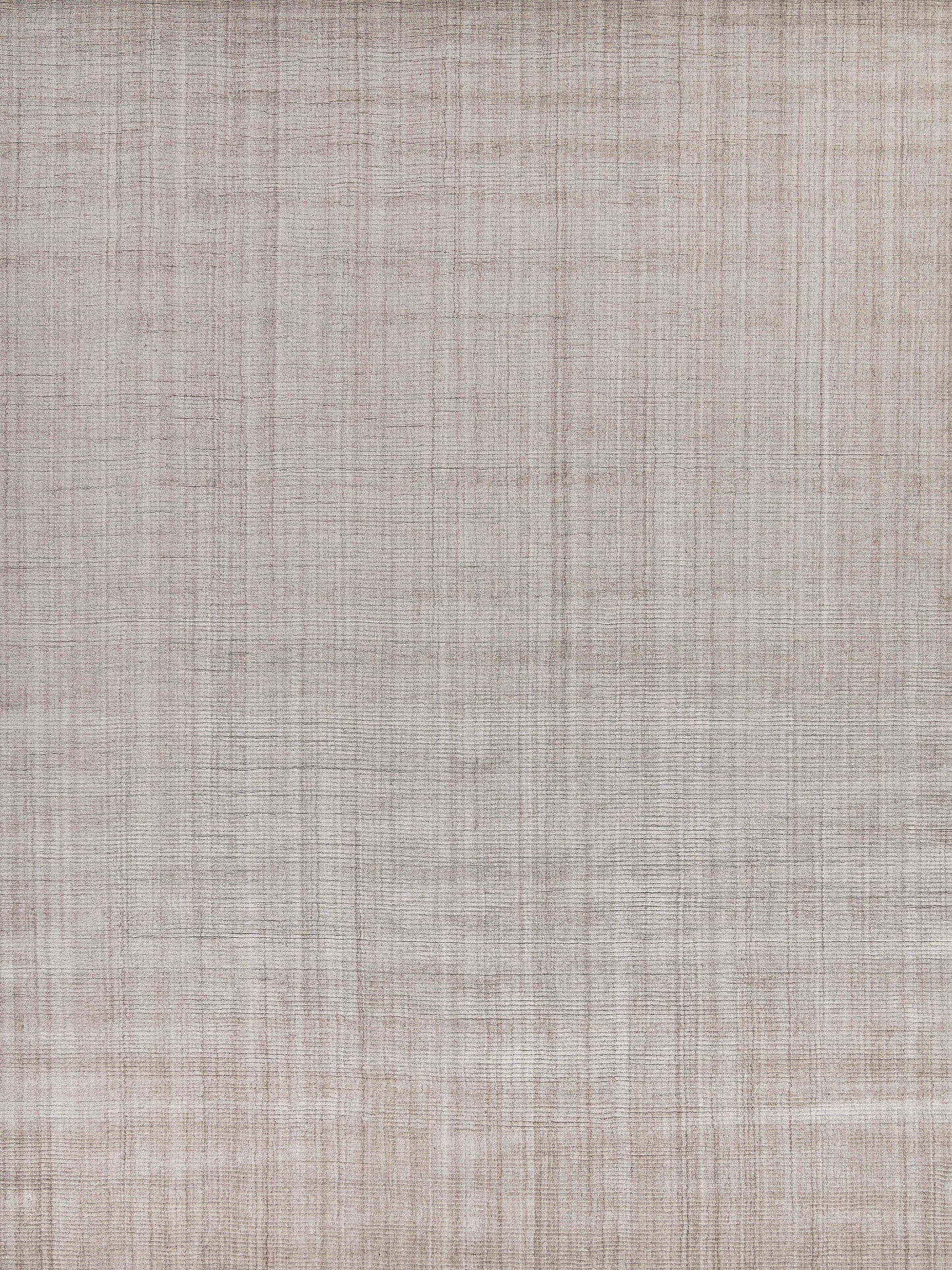 Light taupe indoor hand-loomed rug with linen-like woven texture and subtle crosshatched grid pattern.