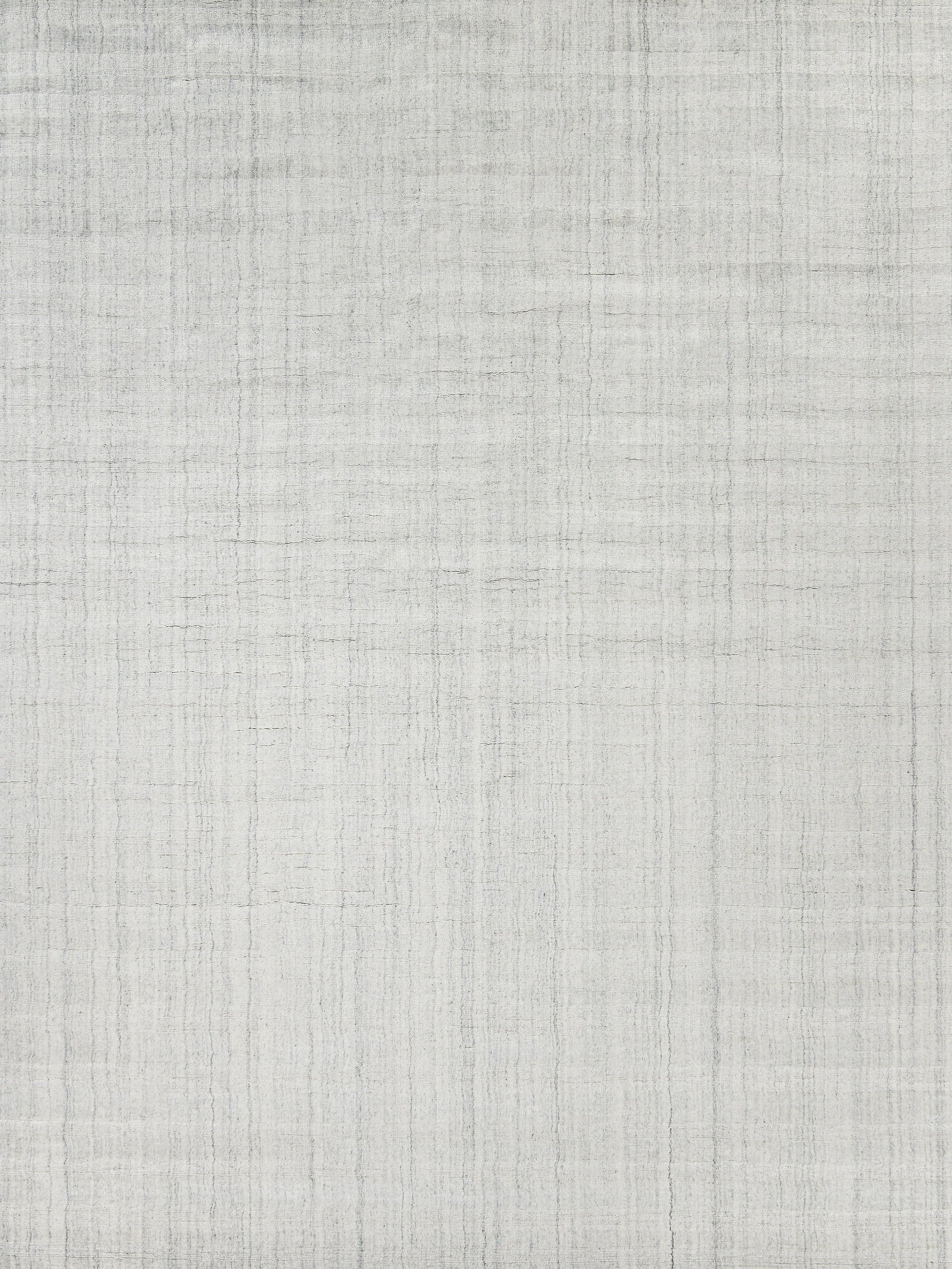 Light gray hand-loomed rug with a subtle woven texture; indoor use, 2' x 3'.