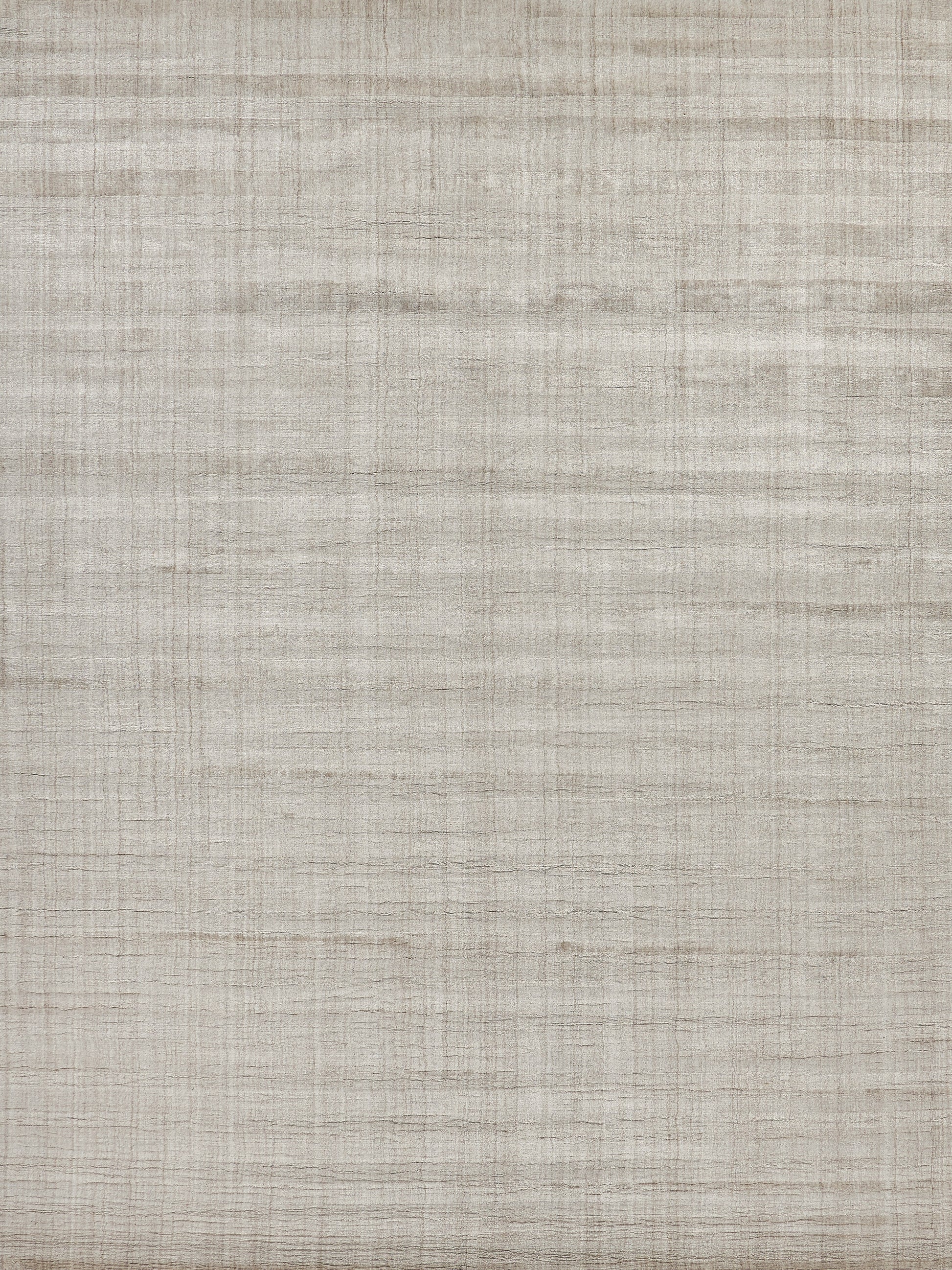 Beige striped rug with a subtle woven texture; hand-loomed, natural-toned floor covering.