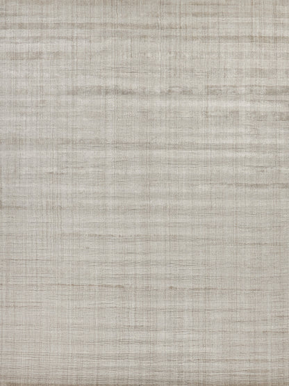 Beige striped rug with a subtle woven texture; hand-loomed, natural-toned floor covering.