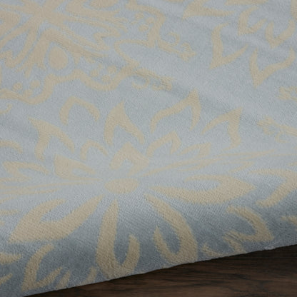 Rectangular light-blue rug with beige floral damask pattern in soft woven fabric, 8' x 10'.