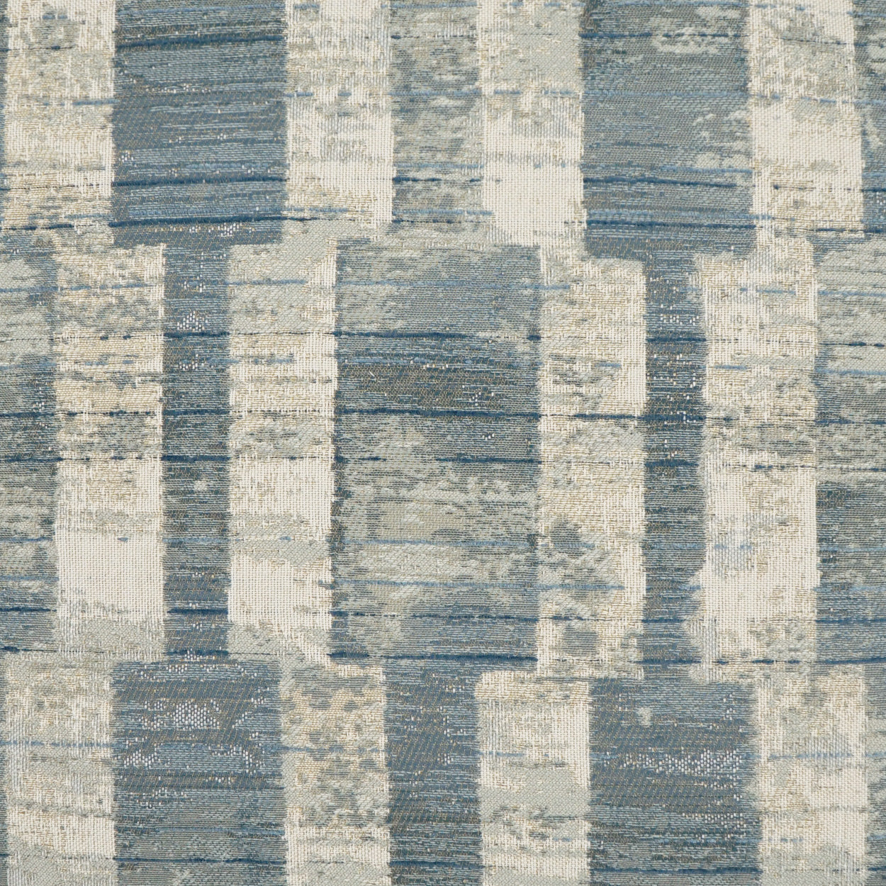 Blue-gray & ivory woven fabric with stacked rectangular blocks in a distressed geometric pattern; upholstery or decor.