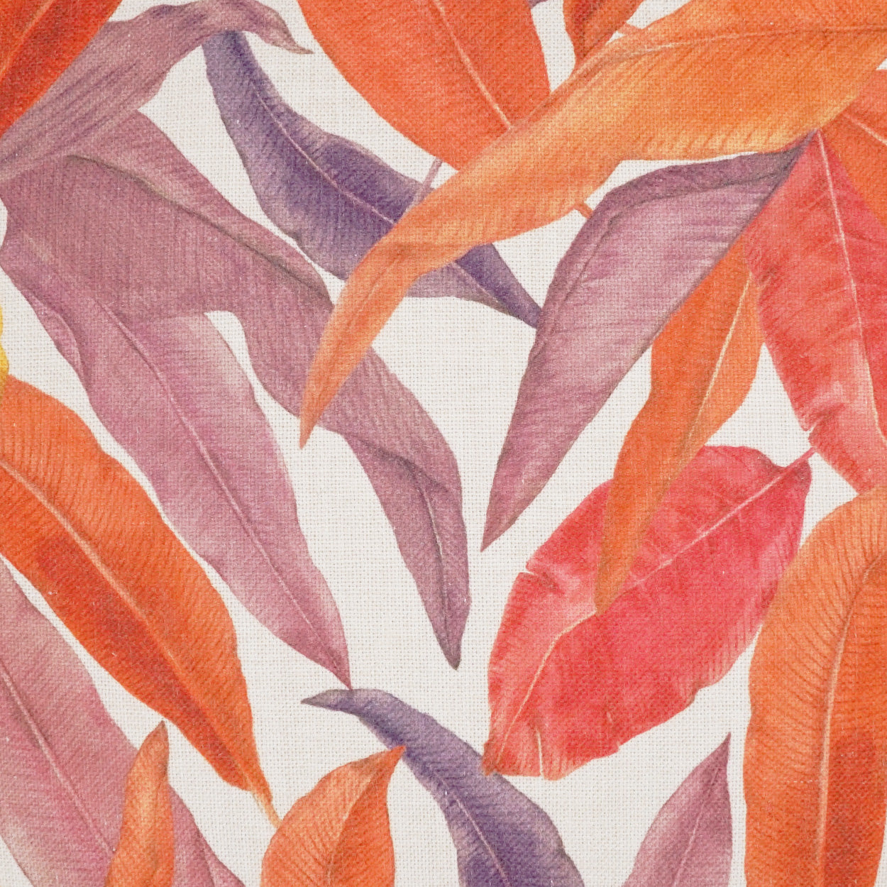 Fabric with an autumn leaf pattern in orange, purple, and pink hues; long slender leaves.