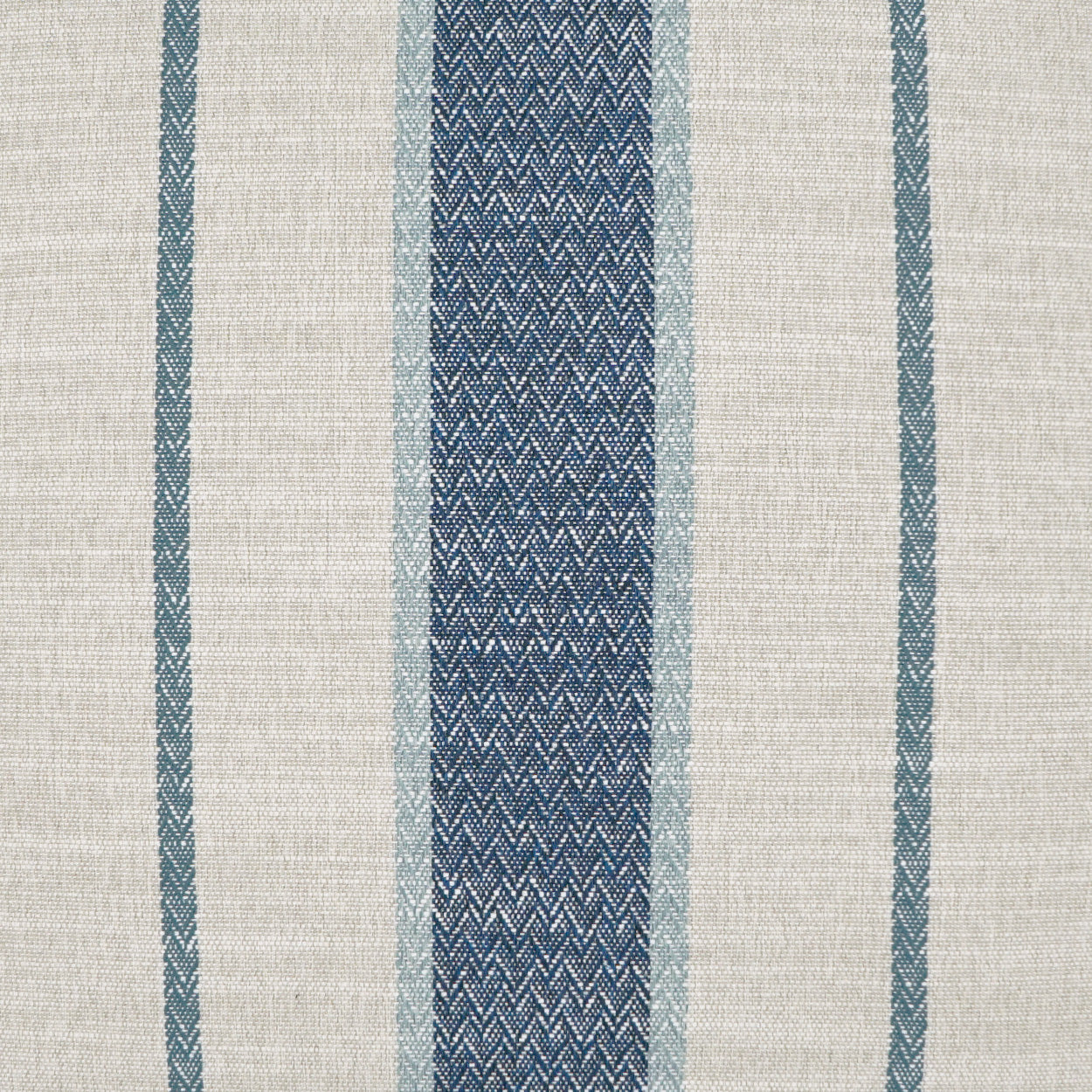Beige woven fabric with vertical blue stripes; wide navy chevron-textured center stripe flanked by lighter blue bands.