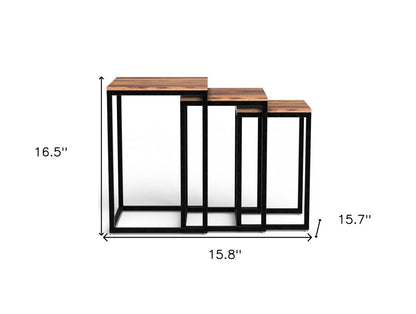 Set of three 17" black and brown solid wood nested tables.