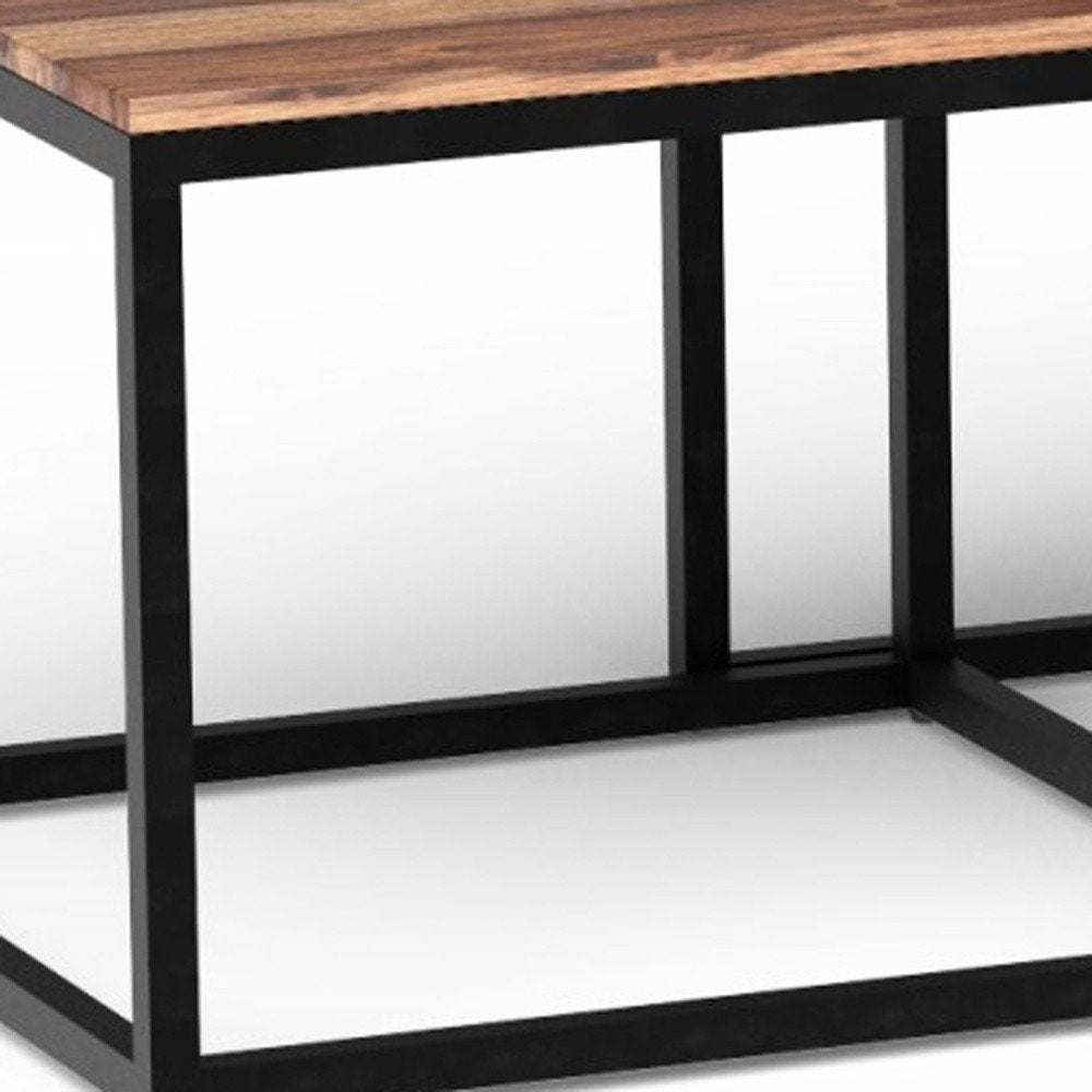 Set of three natural & black solid wood and iron coffee tables, each 47 inches long.