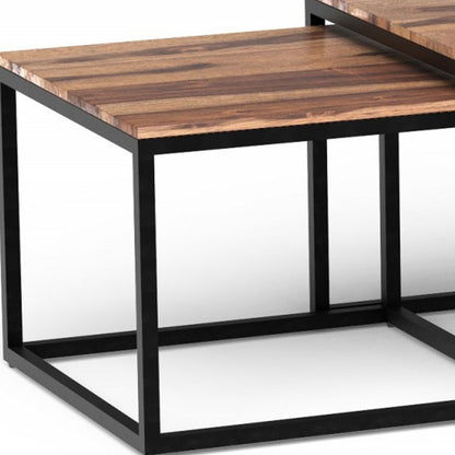 Set of three natural and black solid wood and iron coffee tables, 47" long.