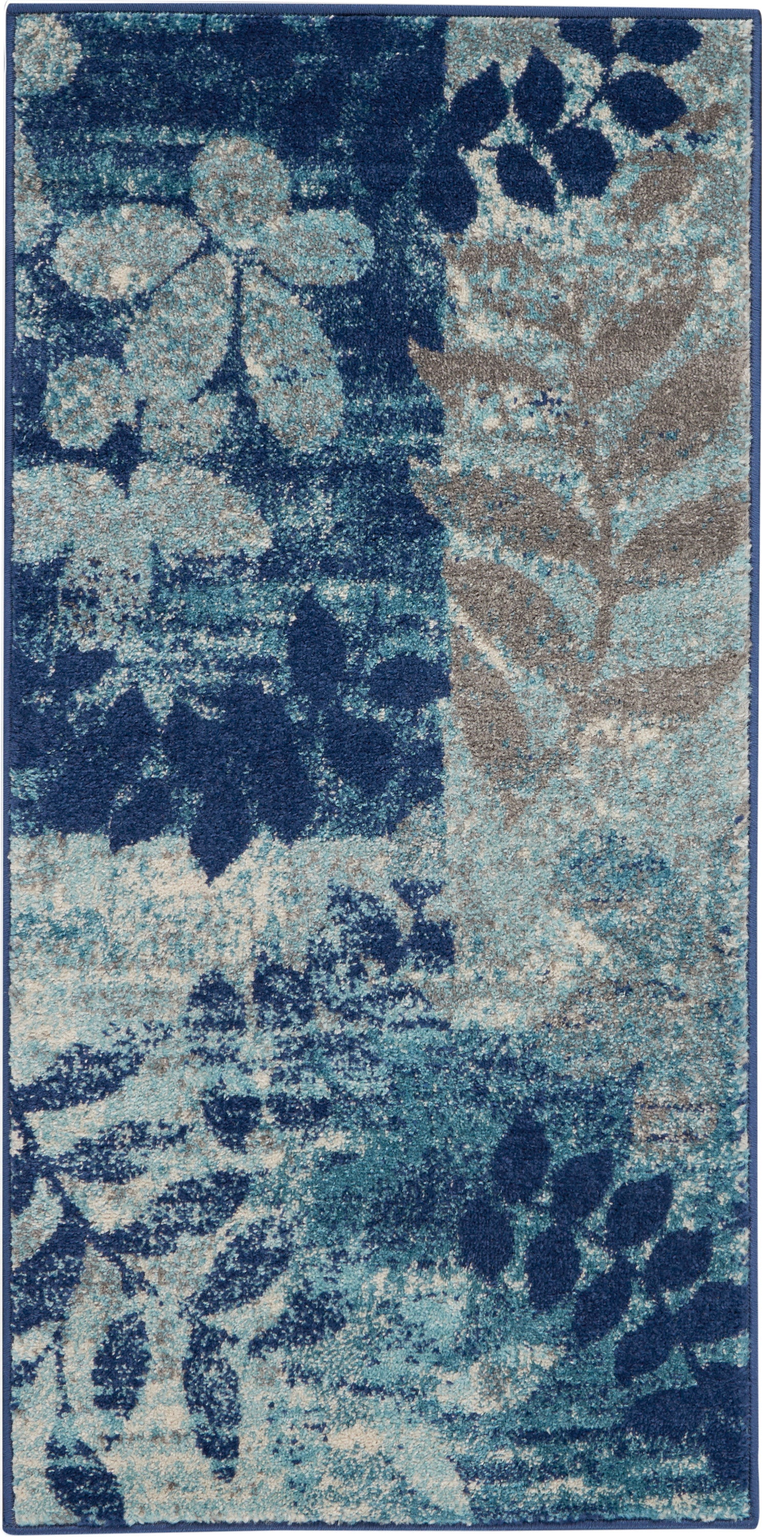 Rectangular rug with navy background and teal-taupe floral leaves in an abstract pattern.