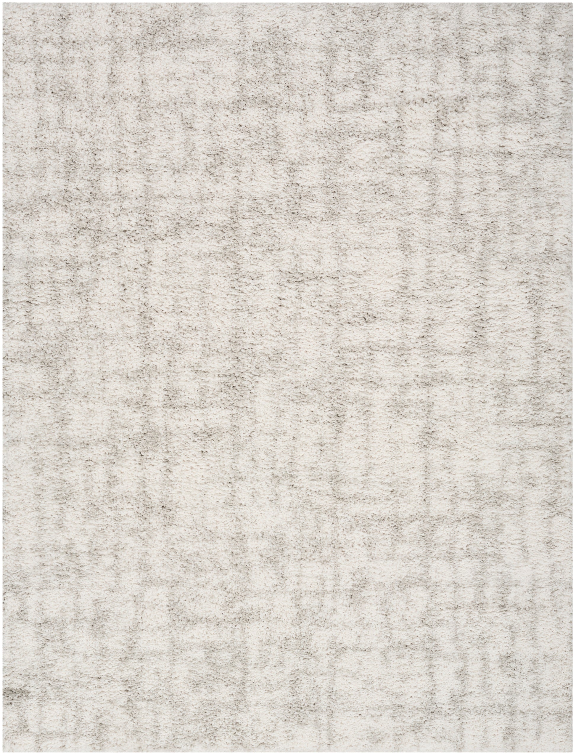 Cream plush area rug with subtle textured pile and light beige mottling.