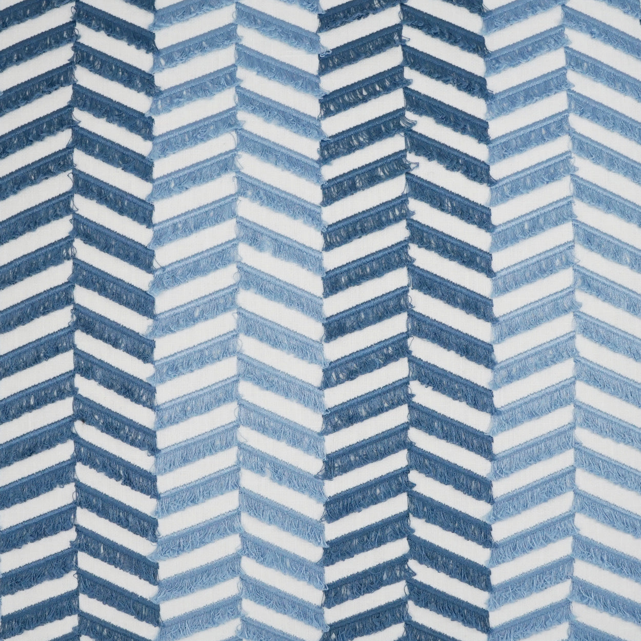 Blue chevron embroidered pillow, 24" x 24", featuring light and dark blue tones.