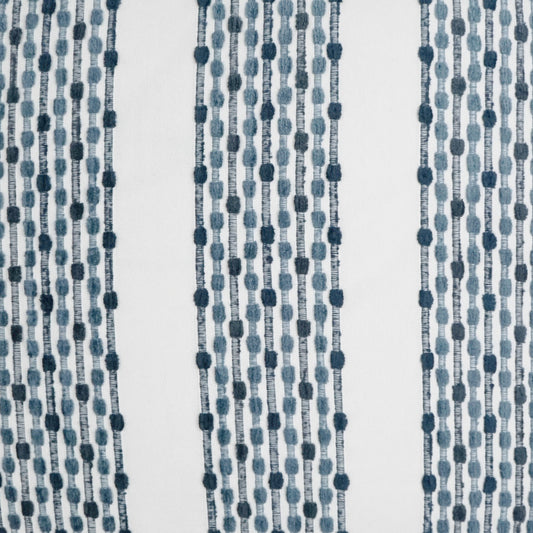 Blue beaded curtain fabric with vertical strings of round beads; decorative textile pattern.