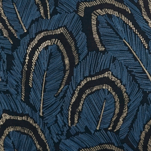 Navy blue woven upholstery fabric with beige curved arc motifs & textured lines; bold abstract pattern.