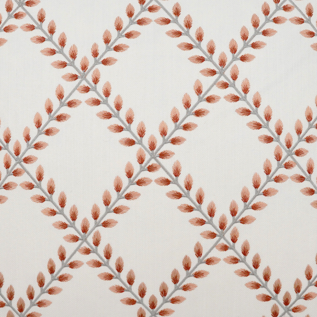 Ivory fabric with rust-orange leaf clusters on gray stems forming a diamond lattice pattern.