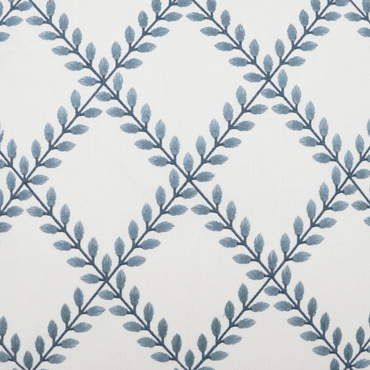 White fabric with blue-gray leafy vine pattern forming a diamond lattice & decorative textile.