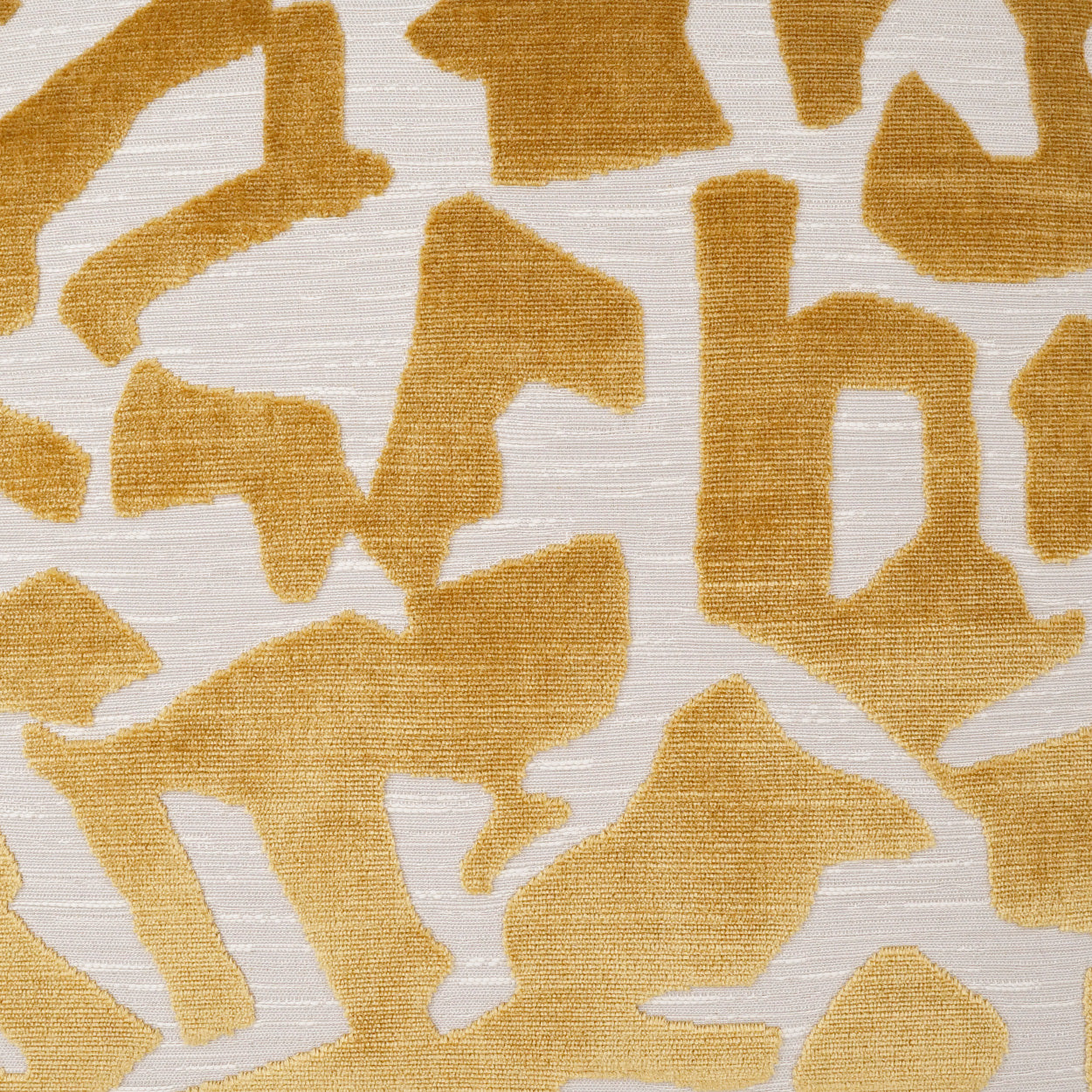 Mustard yellow abstract animal-print fabric on cream background; soft woven textile.