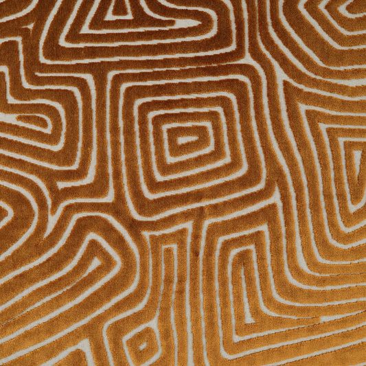 Orange-brown fabric featuring white concentric square maze pattern, geometric retro textile for upholstery or craft projects.