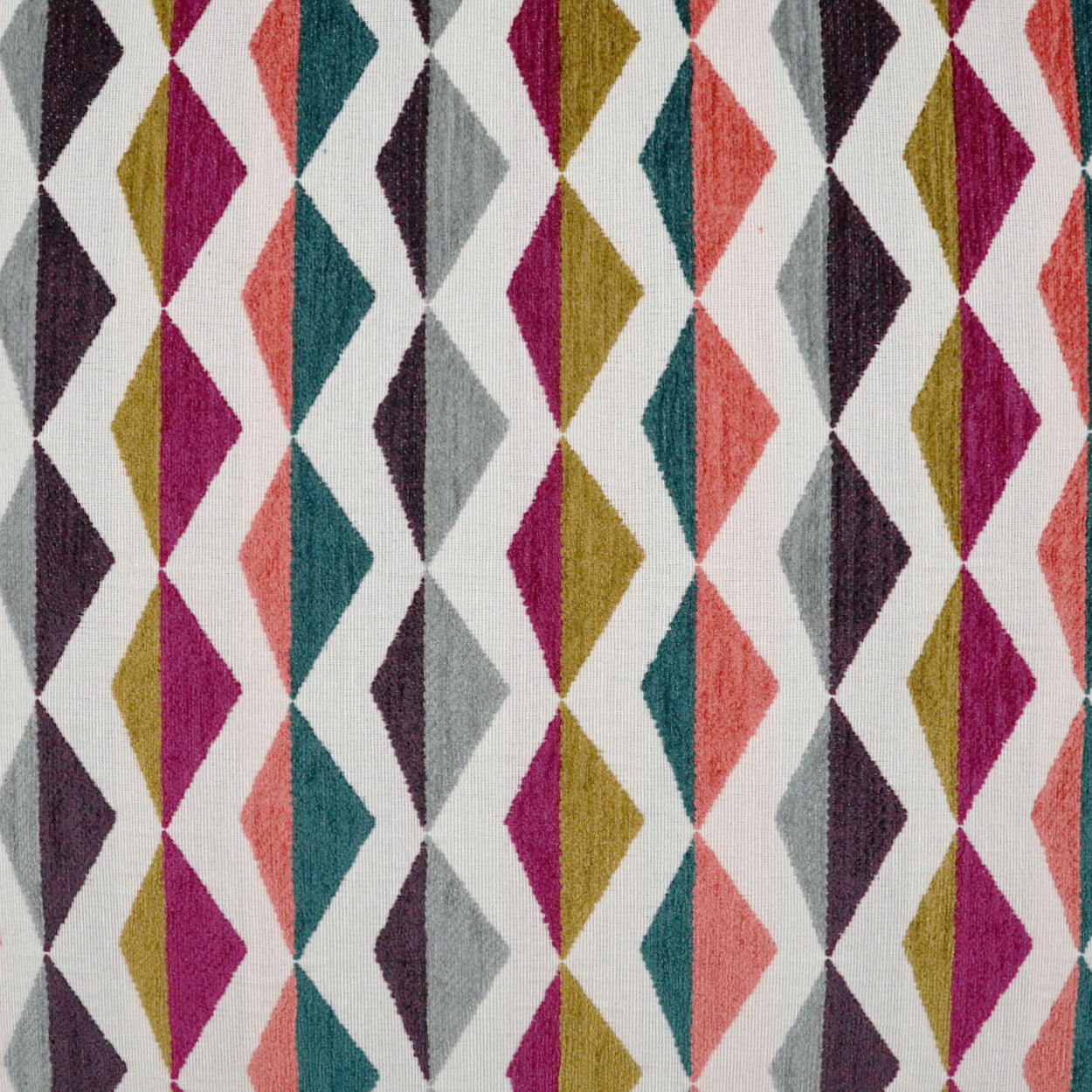 Colorful diamond lattice fabric with zigzag diamonds in magenta, teal, coral, mustard, gray on white; geometric textile.
