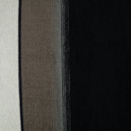Striped fabric swatch in cream, taupe, gray & black panels; woven texture & vertical stripe design.