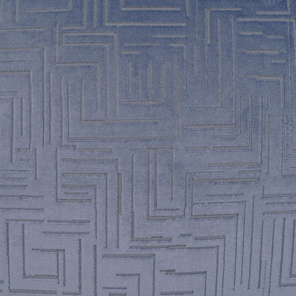 Blue-gray fabric pillow featuring a raised geometric maze pattern and soft textured surface.