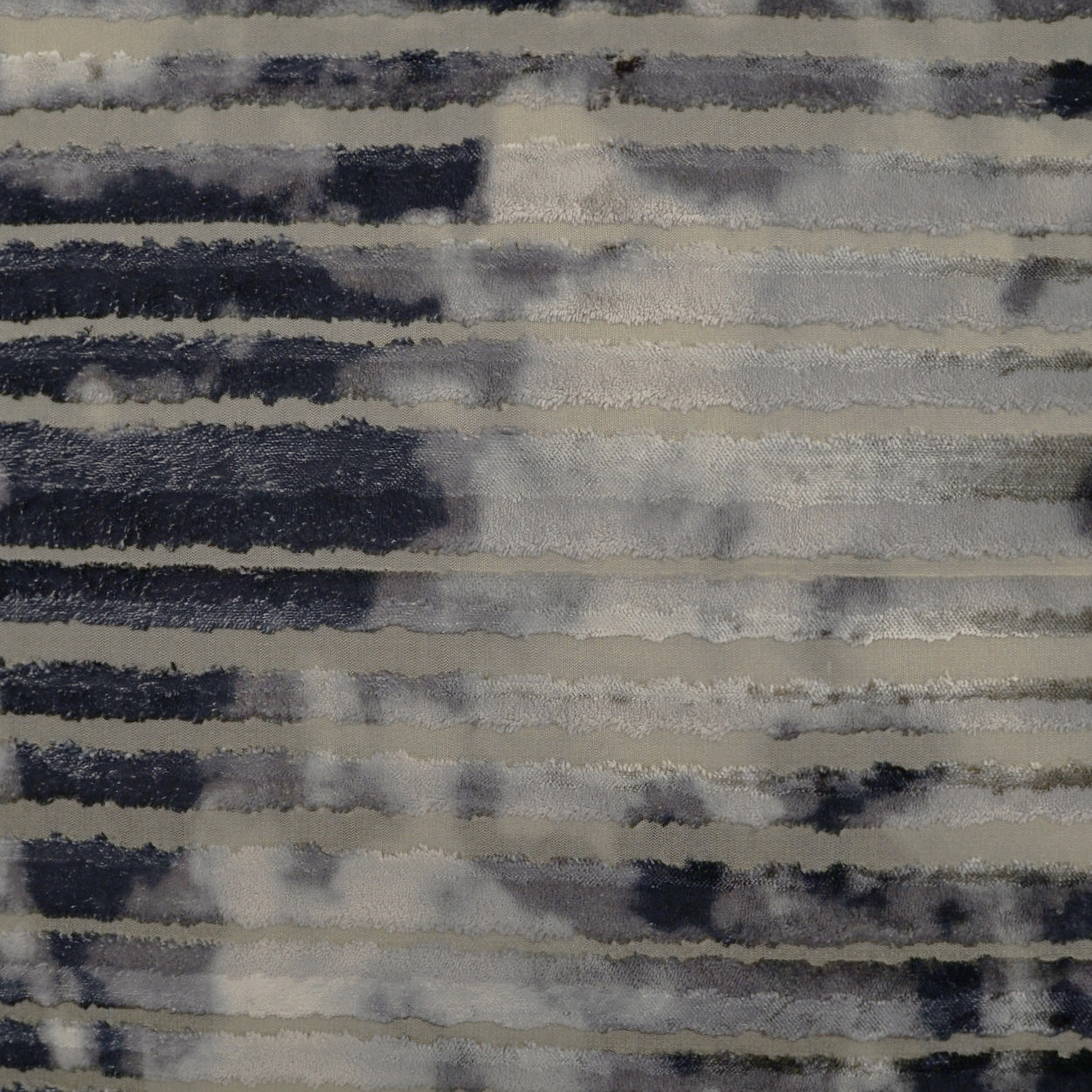 Horizontal striped fabric in navy, gray and cream with soft, brushed texture; versatile upholstery textile.