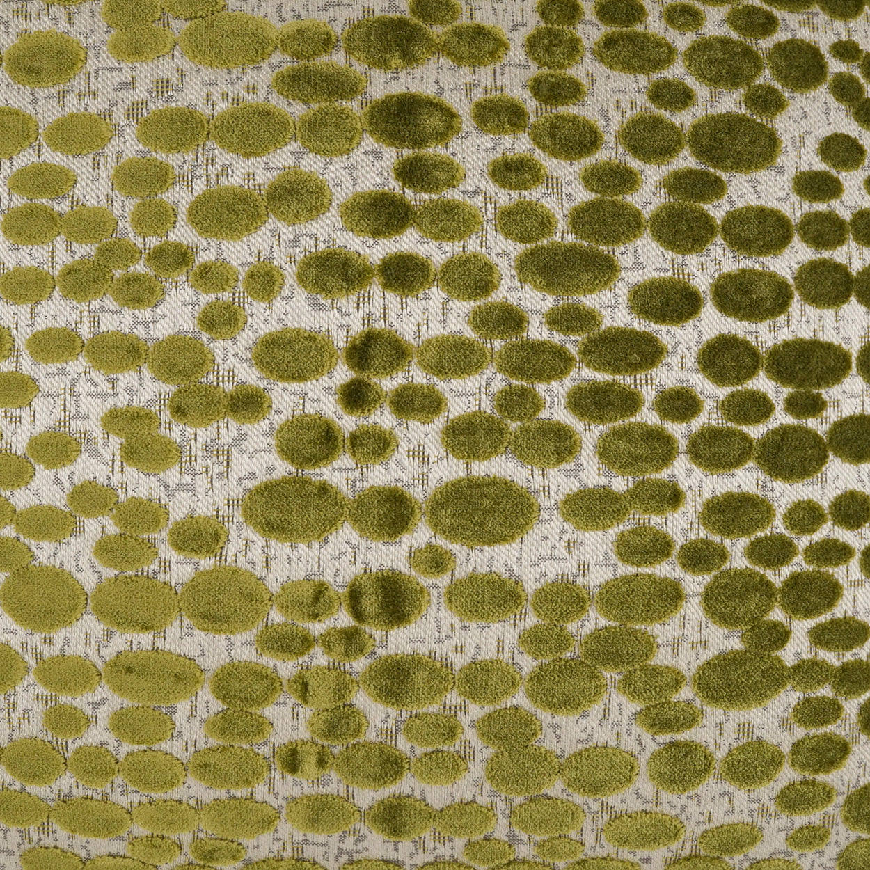 Olive green dotted pattern fabric with fuzzy circular spots on beige background; textured upholstery or décor textile.